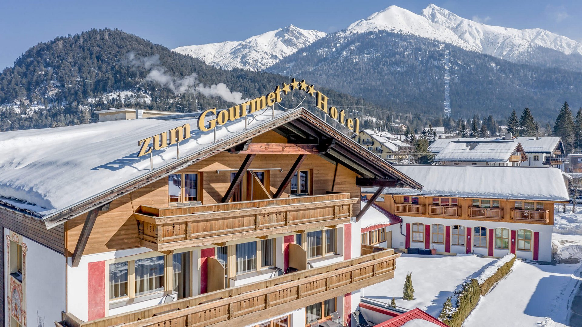 All Inclusive Hotel zum Gourmet **** © Archiv Marcati Hotel Zum Gourmet im verschneiten Bergdorf mit Alpenpanorama